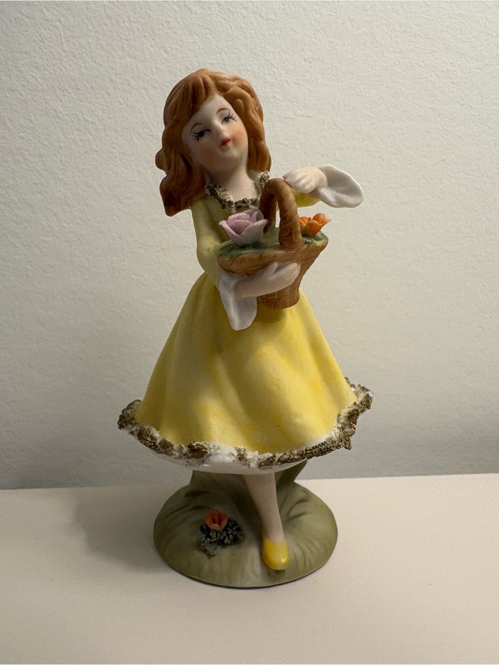 Vintage Ceramic Girl Figurine in Yellow Dress Holding Basket of Flowers